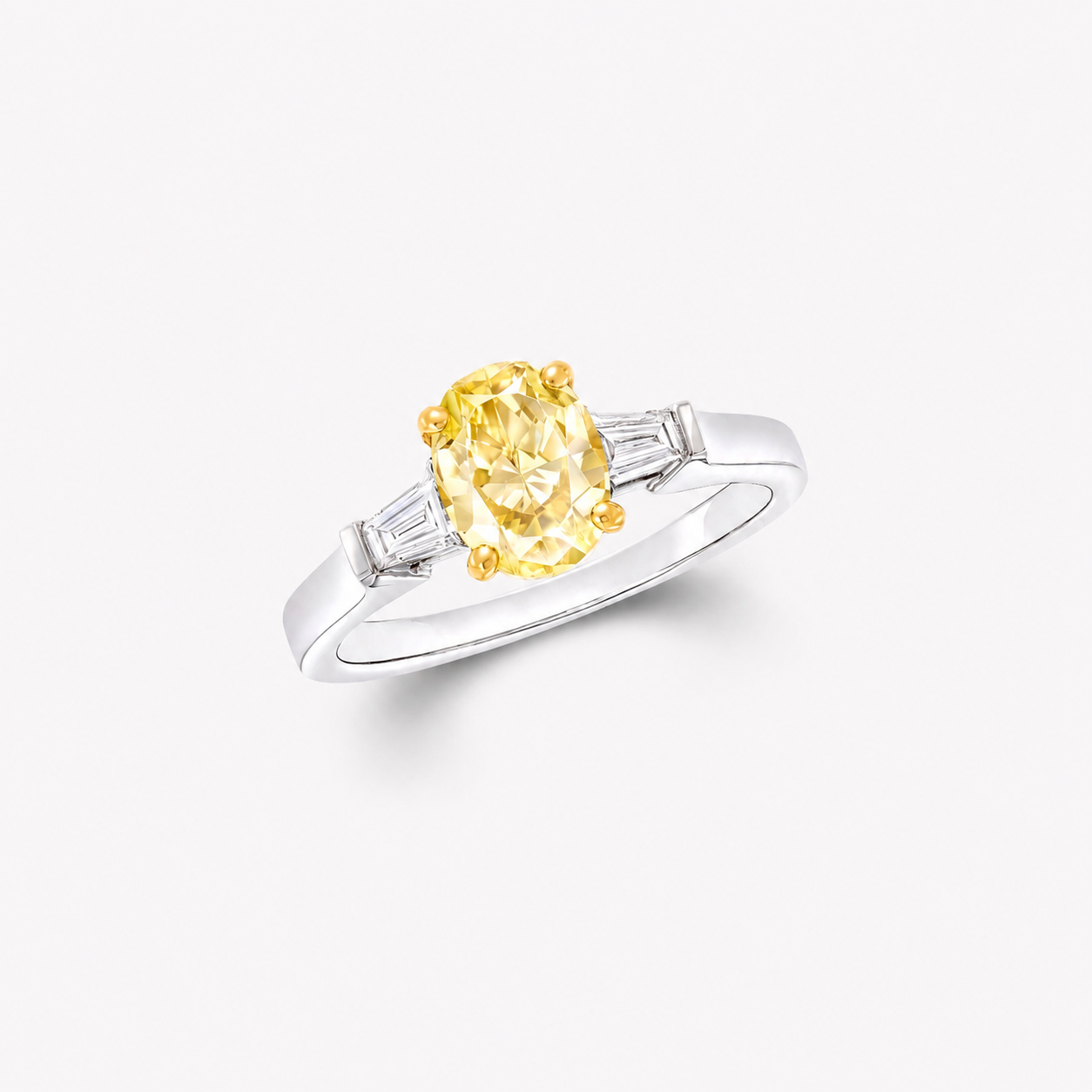 2.50 CT Oval Yellow Lab Diamond Ring with Tapered Baguette Side Stones – IGI Certified | 18K Gold